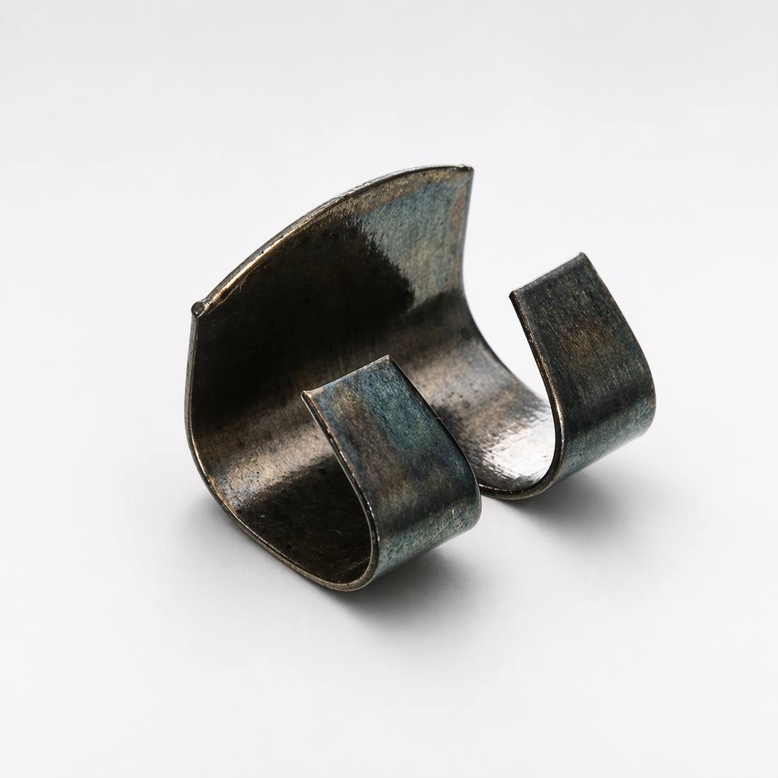 Tin securing clip close-up Close-up of a spring steel tin securing clip